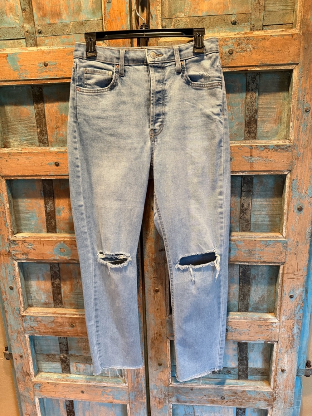 Light Blue Denim high rise jeans with knee rips